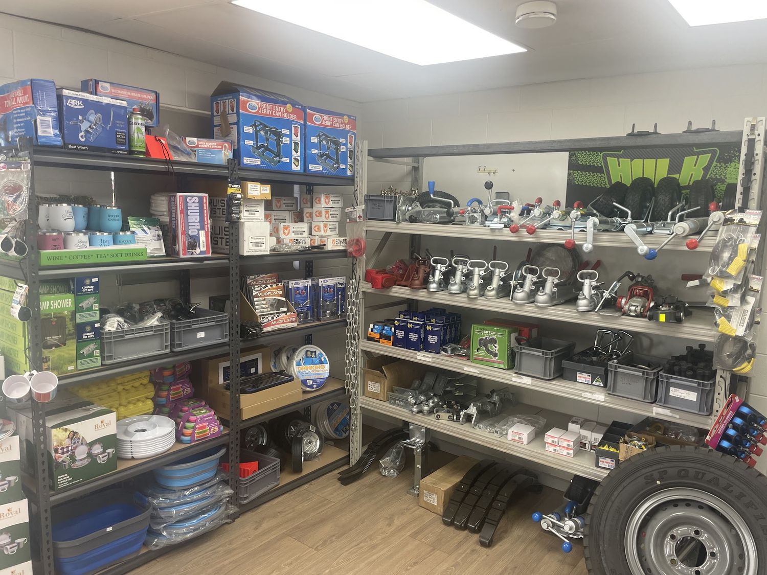 Inside the Casterton Trailers parts shop, shelves stocked with trailer parts and camping gear