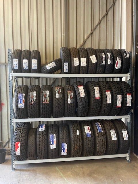 A rack of trailer and caravan tyres in the shed